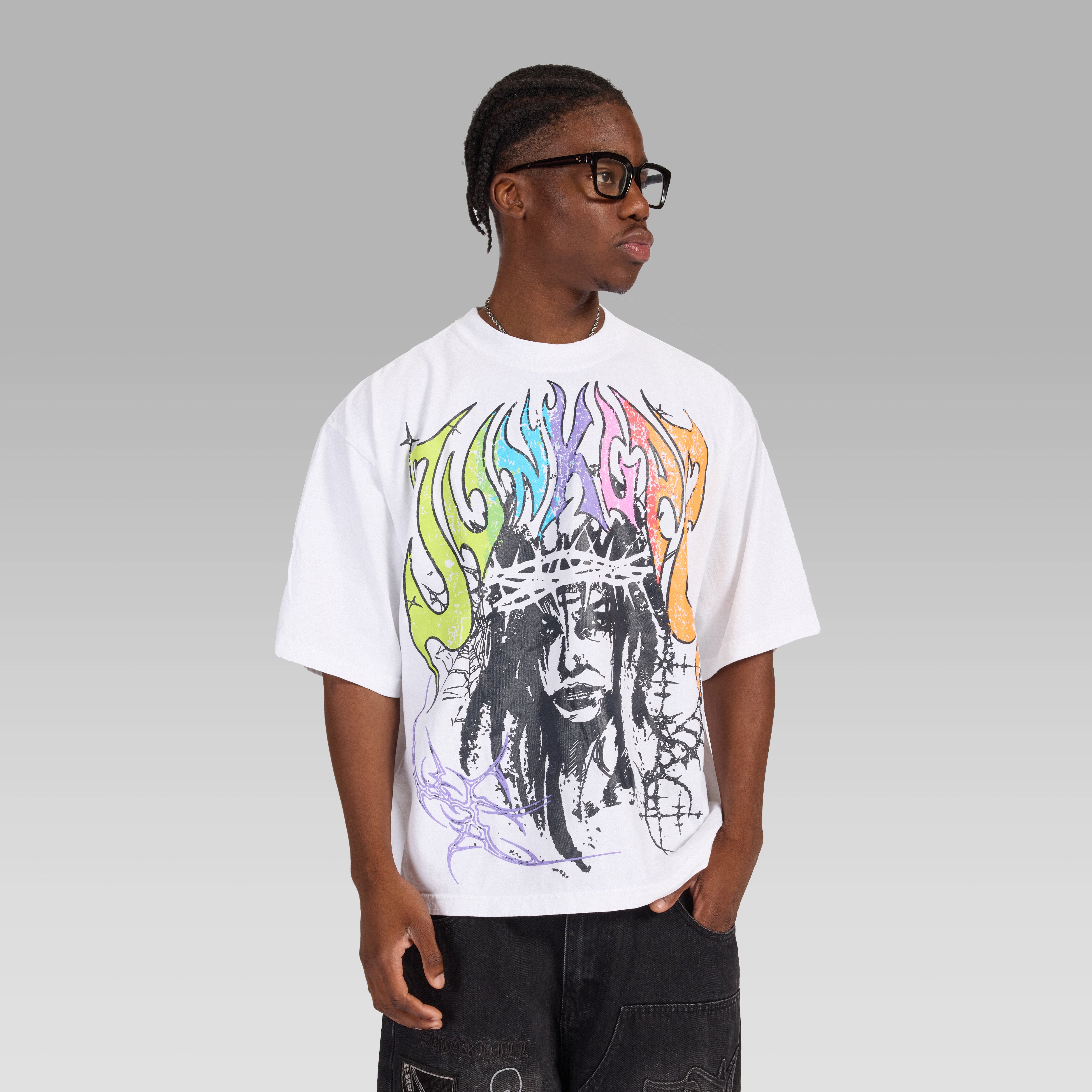 Person wearing a premium white t-shirt with  the words 'Junk Lab' on front and a colorful graphic design on a gray background